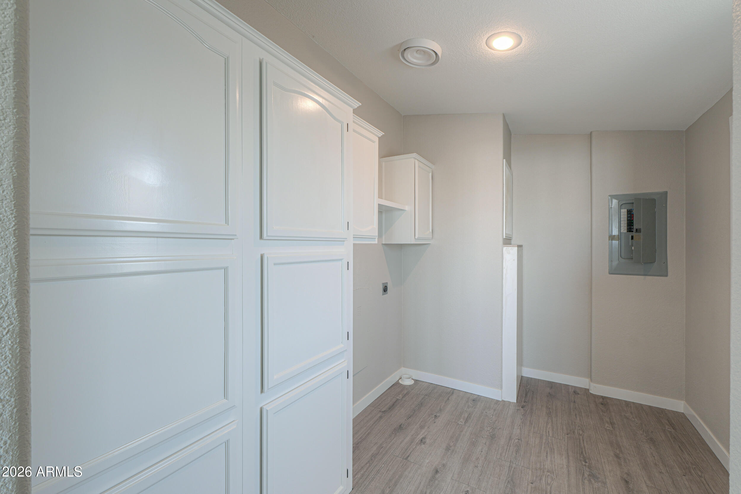 161 North Pueblo Road Maricopa, AZ 85139 - Photo 26 of 76 a view of empty room with wooden floor