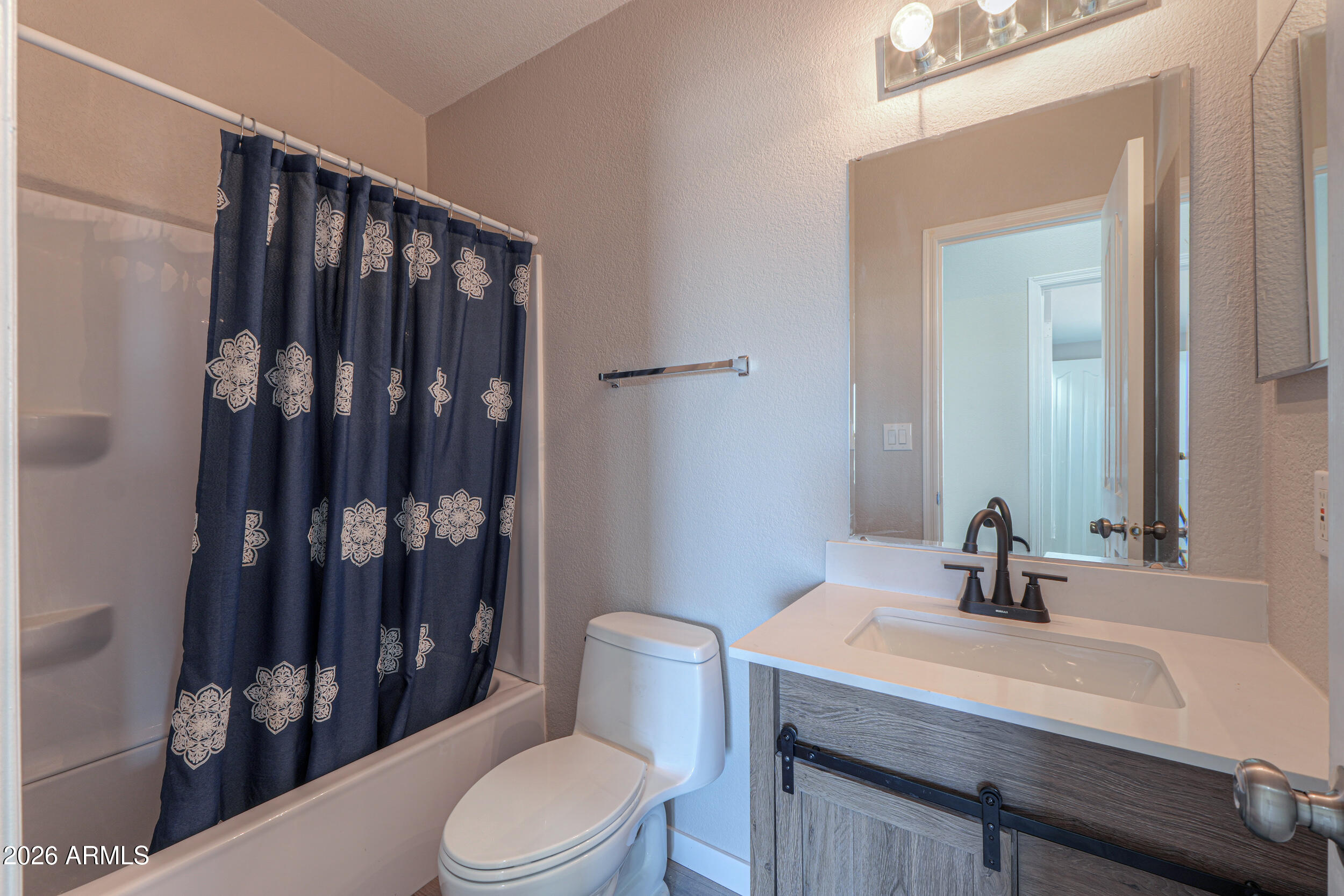 161 North Pueblo Road Maricopa, AZ 85139 - Photo 37 of 76 a bathroom with a sink a toilet and shower