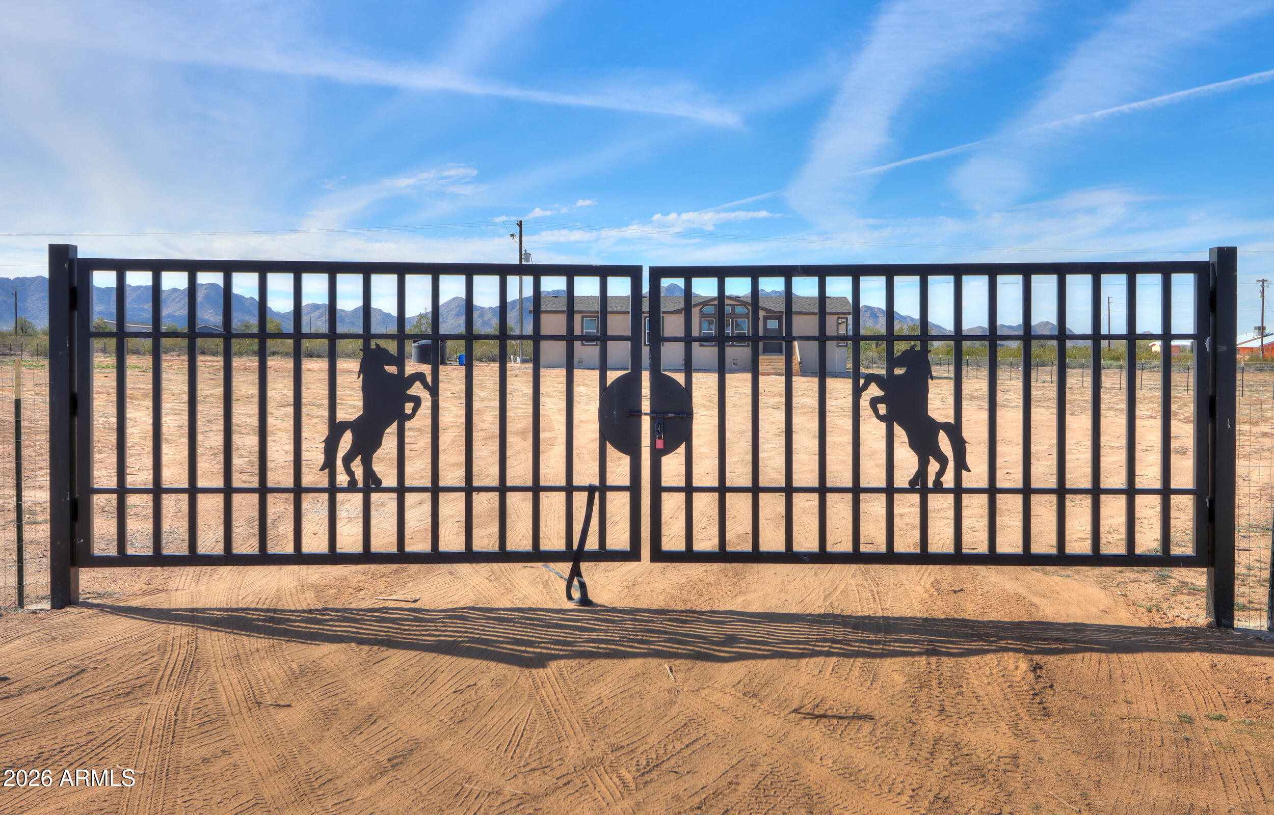 161 North Pueblo Road Maricopa, AZ 85139 - Photo 3 of 76 a view of a black gate