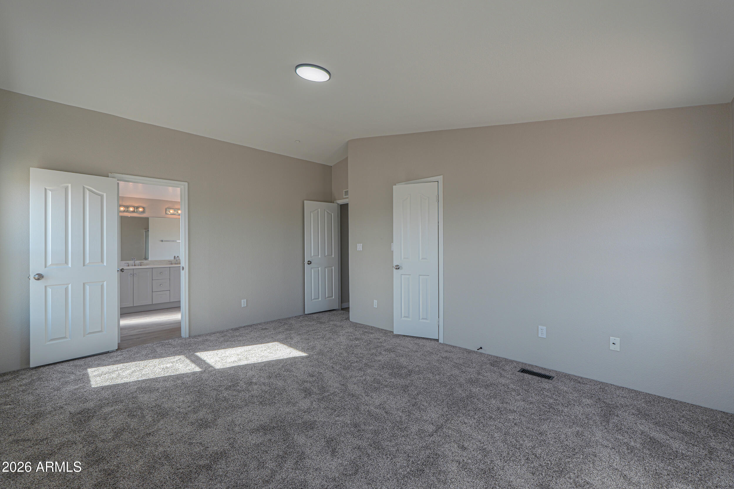 161 North Pueblo Road Maricopa, AZ 85139 - Photo 40 of 76 a view of an empty room and closet area