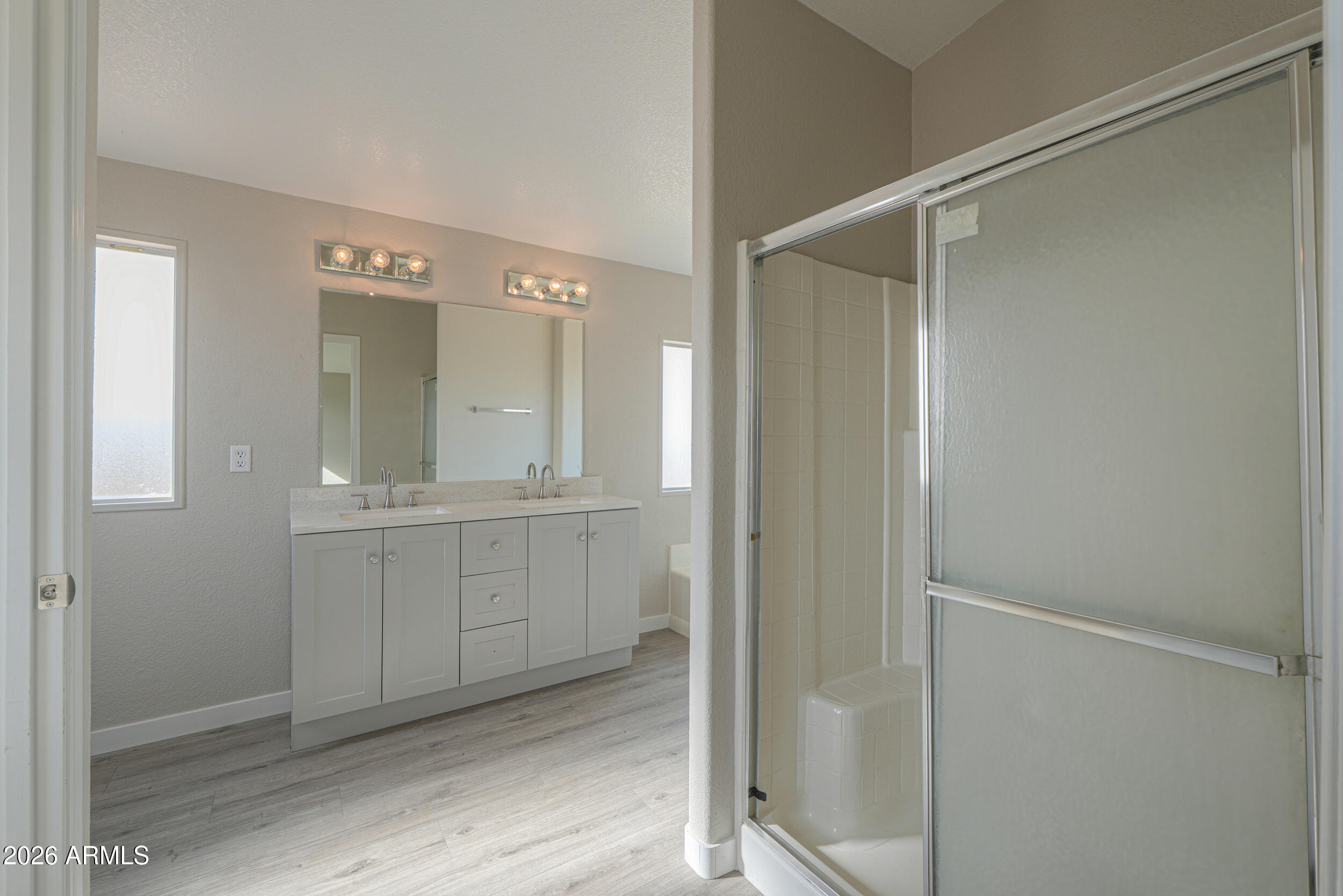 161 North Pueblo Road Maricopa, AZ 85139 - Photo 43 of 76 a bathroom with a shower and a sink