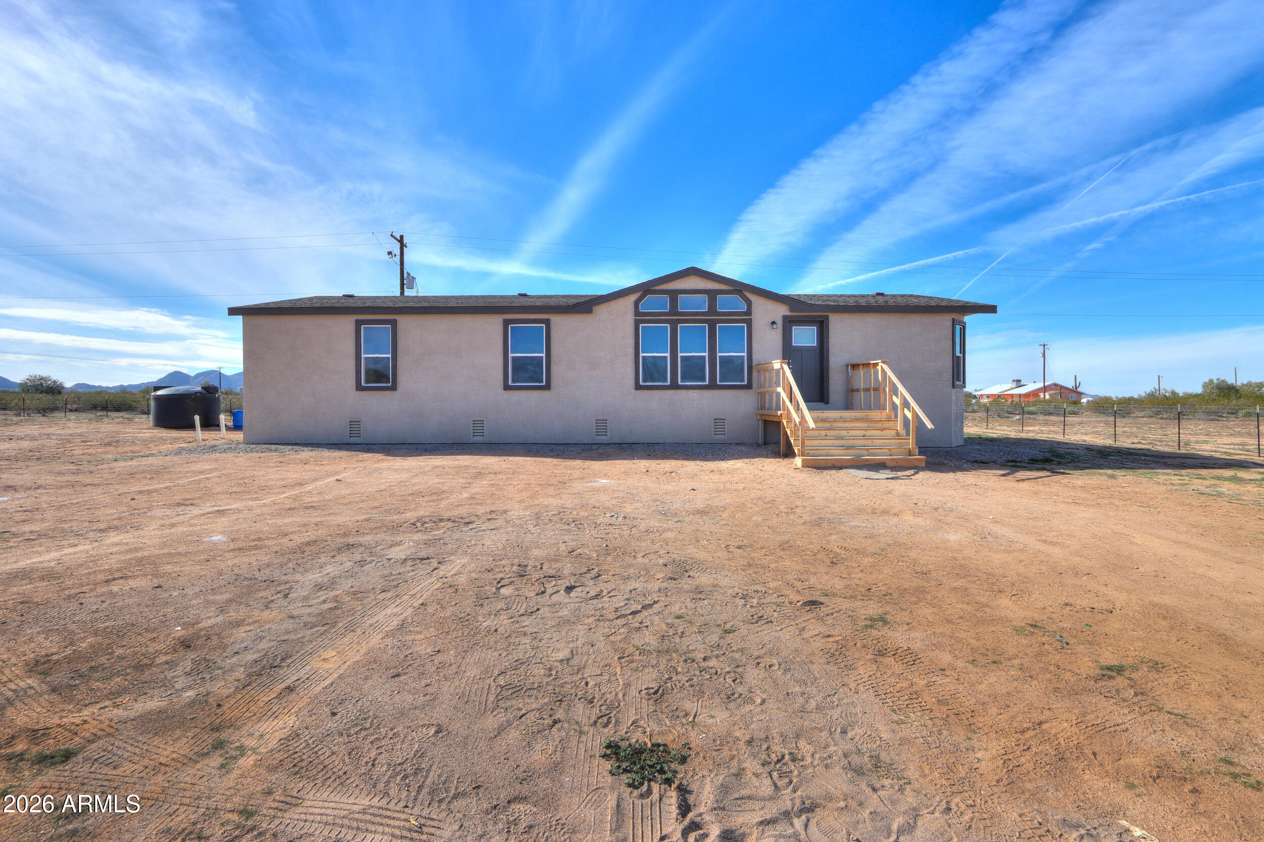 161 North Pueblo Road Maricopa, AZ 85139 - Photo 5 of 76 a front view of a house with a yard