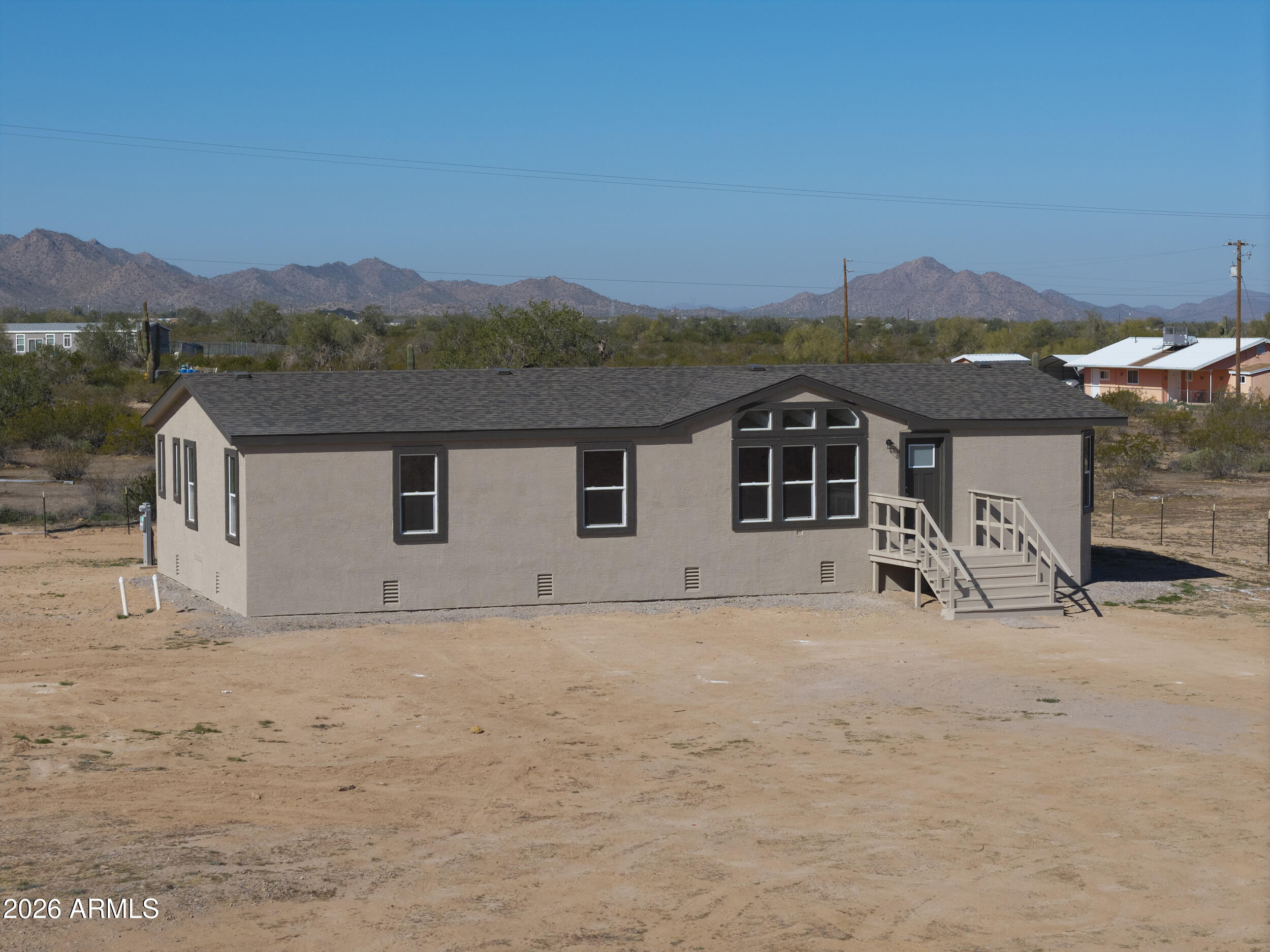 161 North Pueblo Road Maricopa, AZ 85139 - Photo 69 of 76 a front view of a house with a yard
