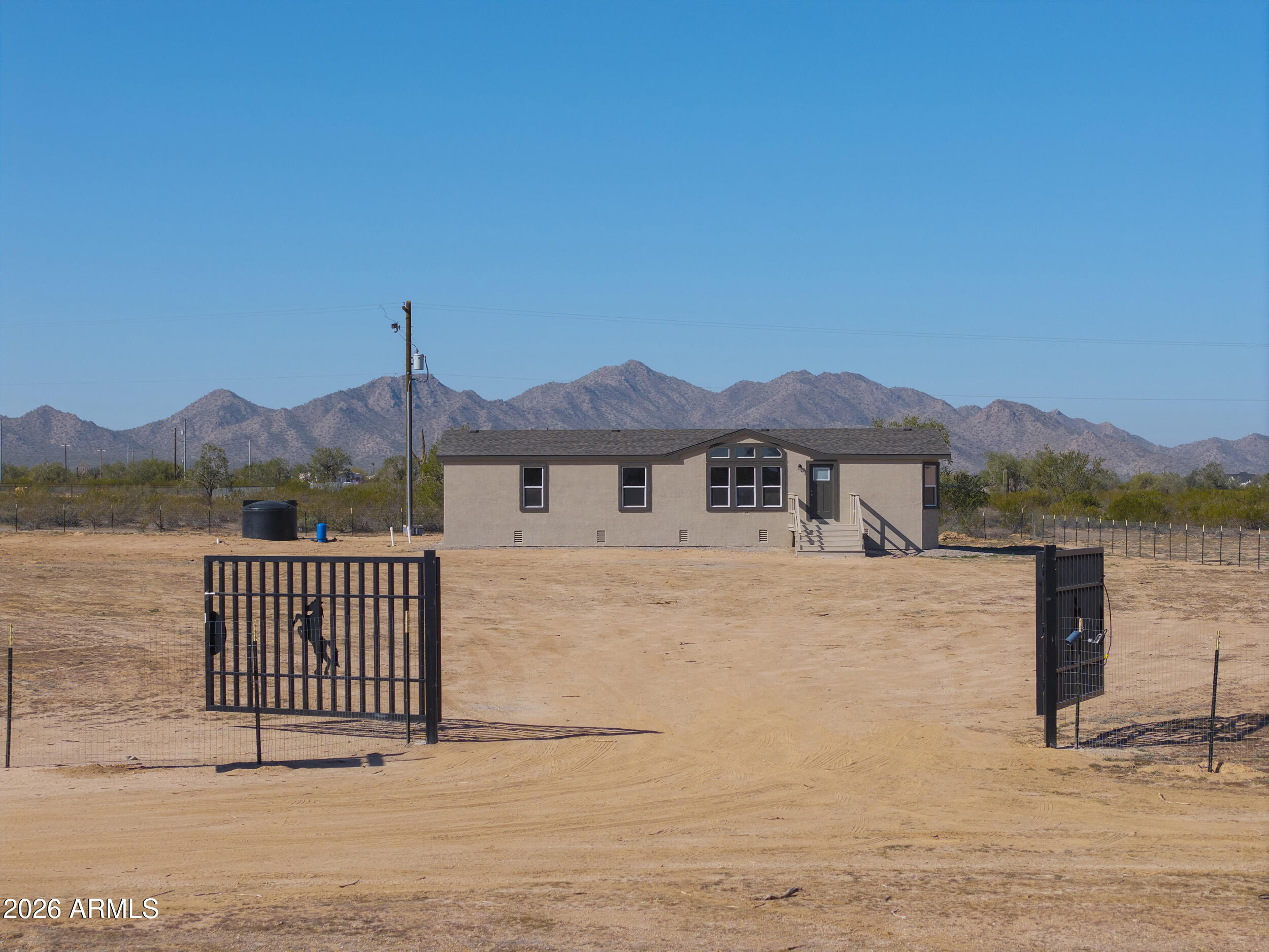 161 North Pueblo Road Maricopa, AZ 85139 - Photo 73 of 76 a front view of a house with a yard