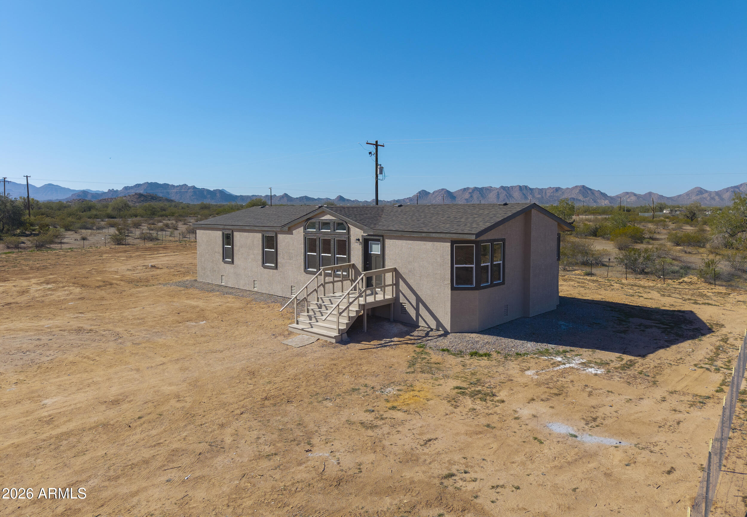 161 North Pueblo Road Maricopa, AZ 85139 - Photo 74 of 76 a view of a house with a yard