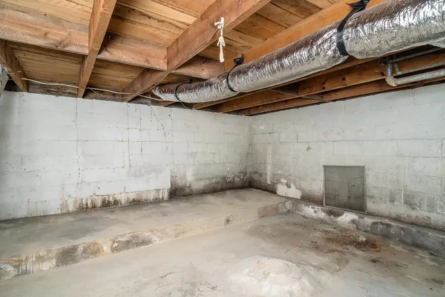 a view of a room with wooden walls