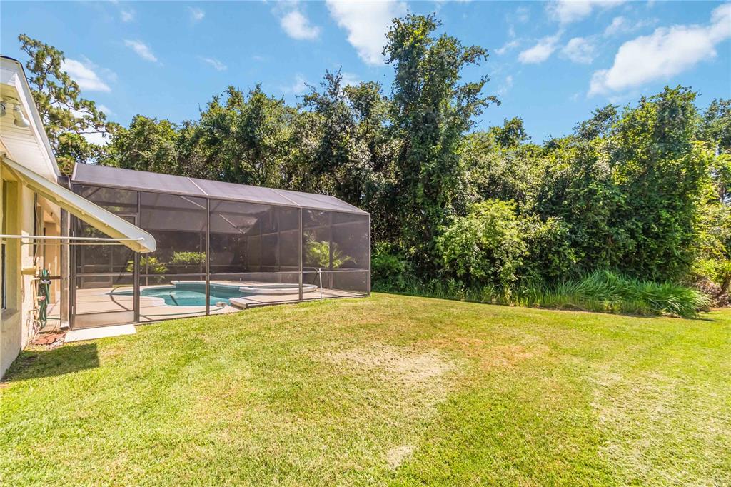 3225 Canoe Creek Road St. Cloud, FL 34772 - Photo 30 of 30 a view of a swimming pool with an outdoor space and seating area