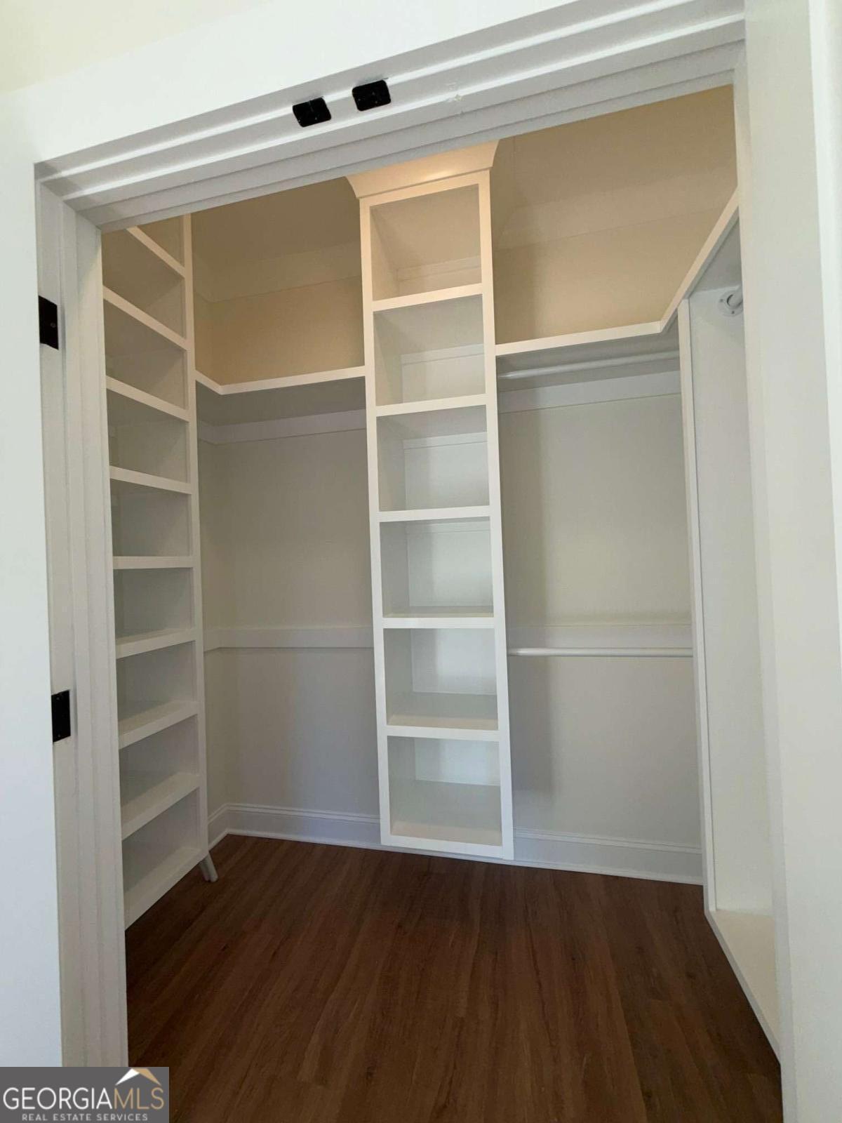 350 Rucker Lane, Unit AB Statesboro, GA 30458 - Photo 10 of 20 a view of an empty room with wooden floor and a window