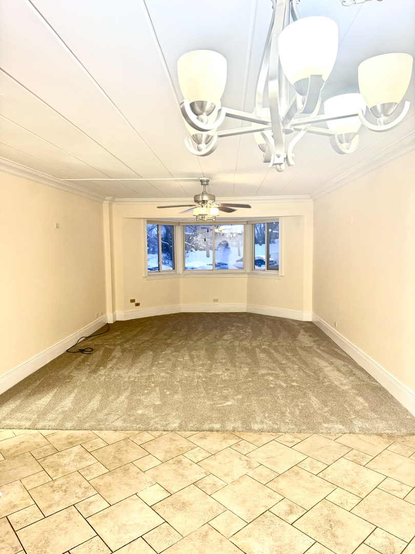 300 South Roselle Road, Unit 207 Schaumburg, IL 60193 - Photo 9 of 17 a view of an empty room and a window