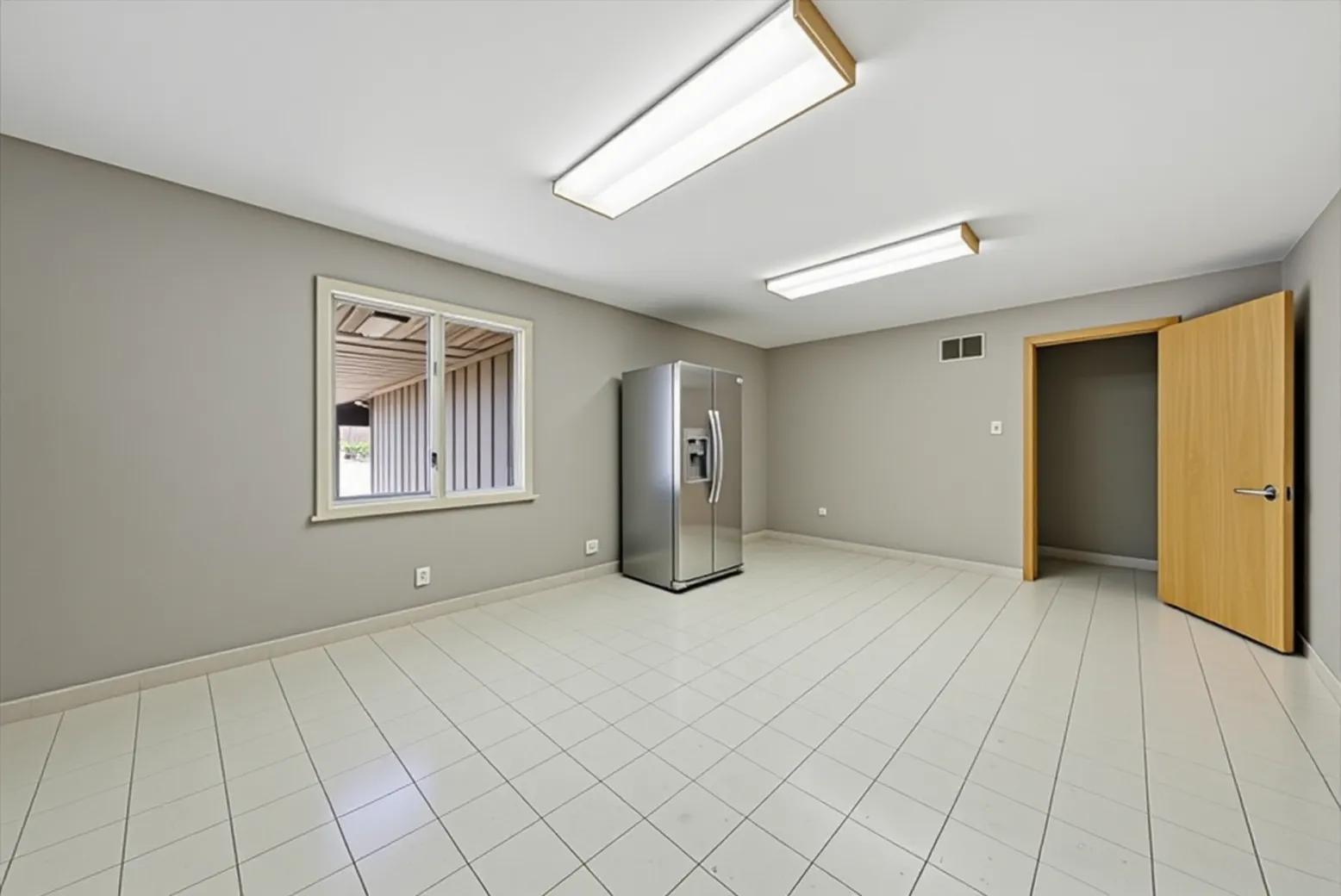2304 Plainfield Road Crest Hill, IL 60403 - Photo 15 of 56 a view of an empty room with window and chandelier