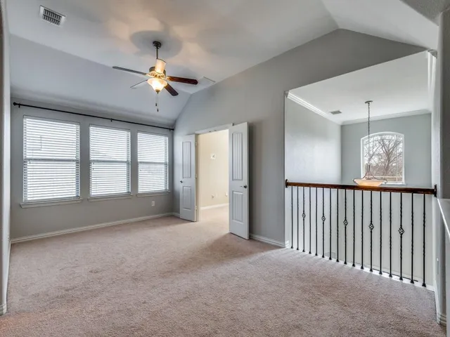 a bathroom with a granite countertop sink a toilet a mirror and bathtub