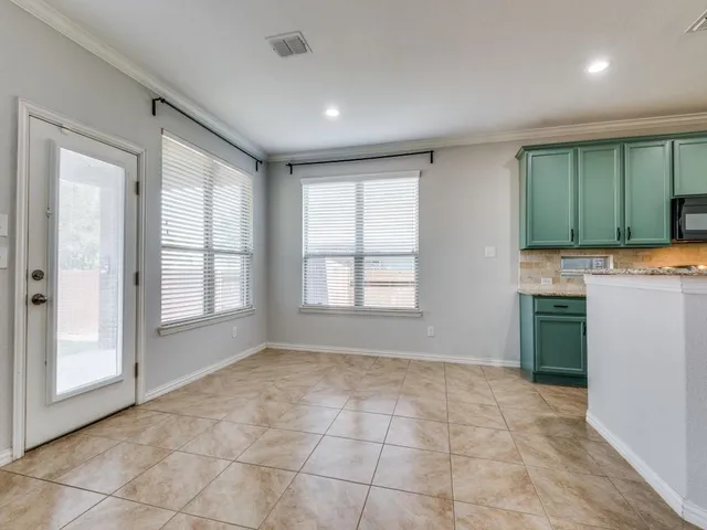 a spacious bathroom with a double vanity sink mirror and double