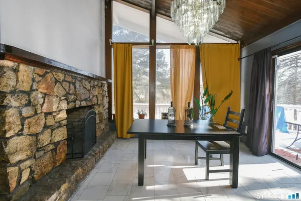 a view of a entryway with furniture and a porch