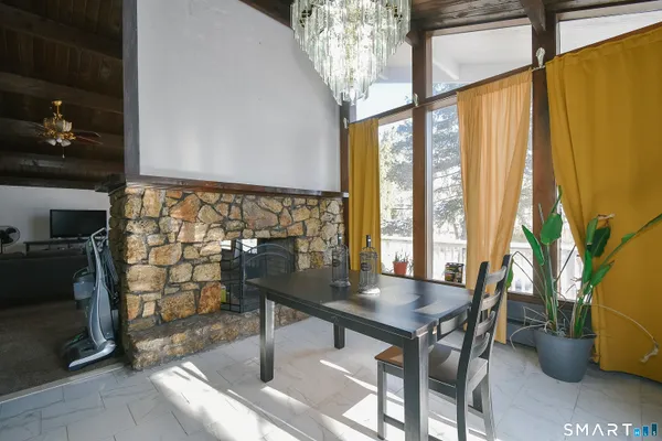 a view of a livingroom with furniture and window