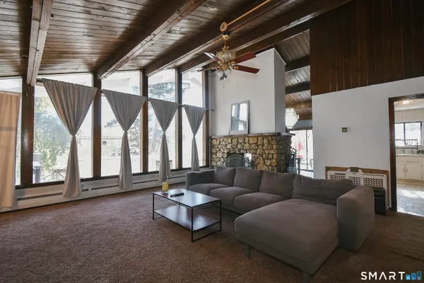 a living room with furniture and a large window