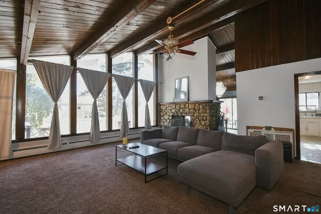 a living room with furniture and a large window