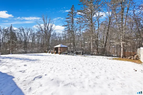 a wooden bench sitting in middle of a snow