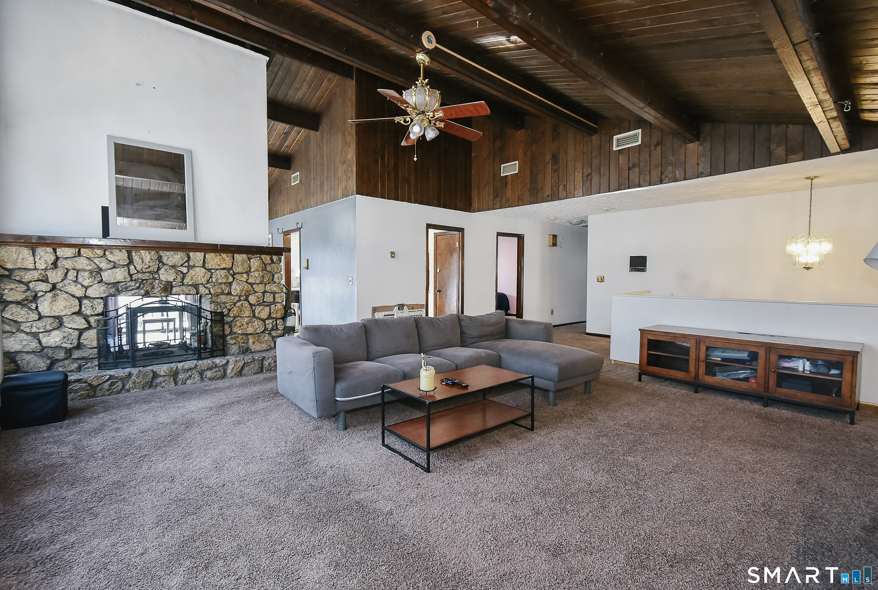 63 Millbrook Road Middletown, CT 06457 - Photo 9 of 29 a living room with furniture and a fireplace