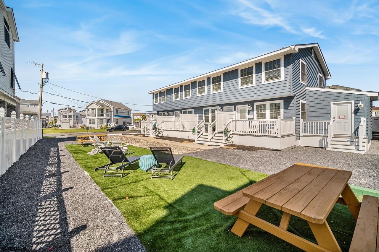 229 10th Street North, Unit 2 Brigantine, NJ 08203 - Photo 17 of 27 a swimming pool with outdoor seating and yard