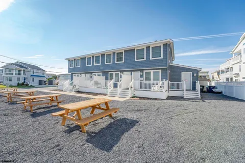 a swimming pool with outdoor seating and yard