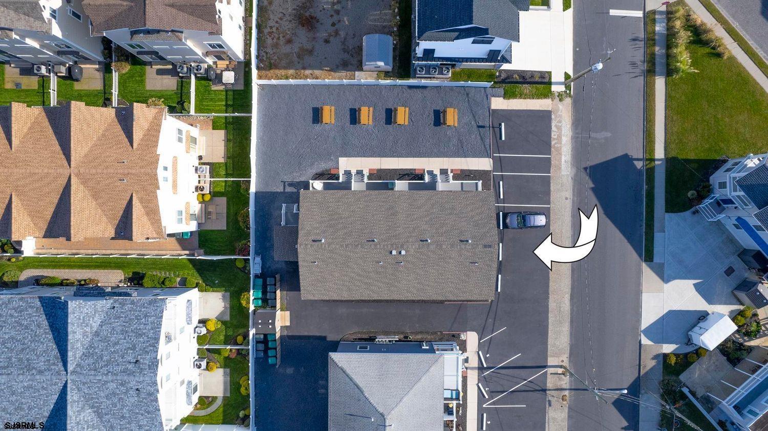 229 10th Street North, Unit 2 Brigantine, NJ 08203 - Photo 24 of 27 an aerial view of residential houses with outdoor space