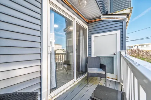a balcony with view of outdoor space