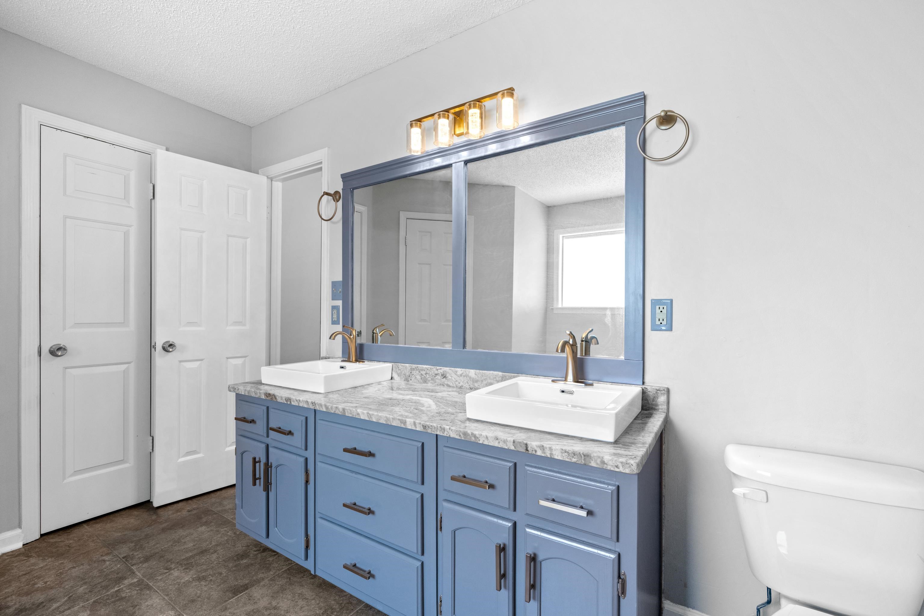 1361 Milestone Circle Collierville, TN 38017 - Photo 17 of 23 a bathroom with a sink and a mirror