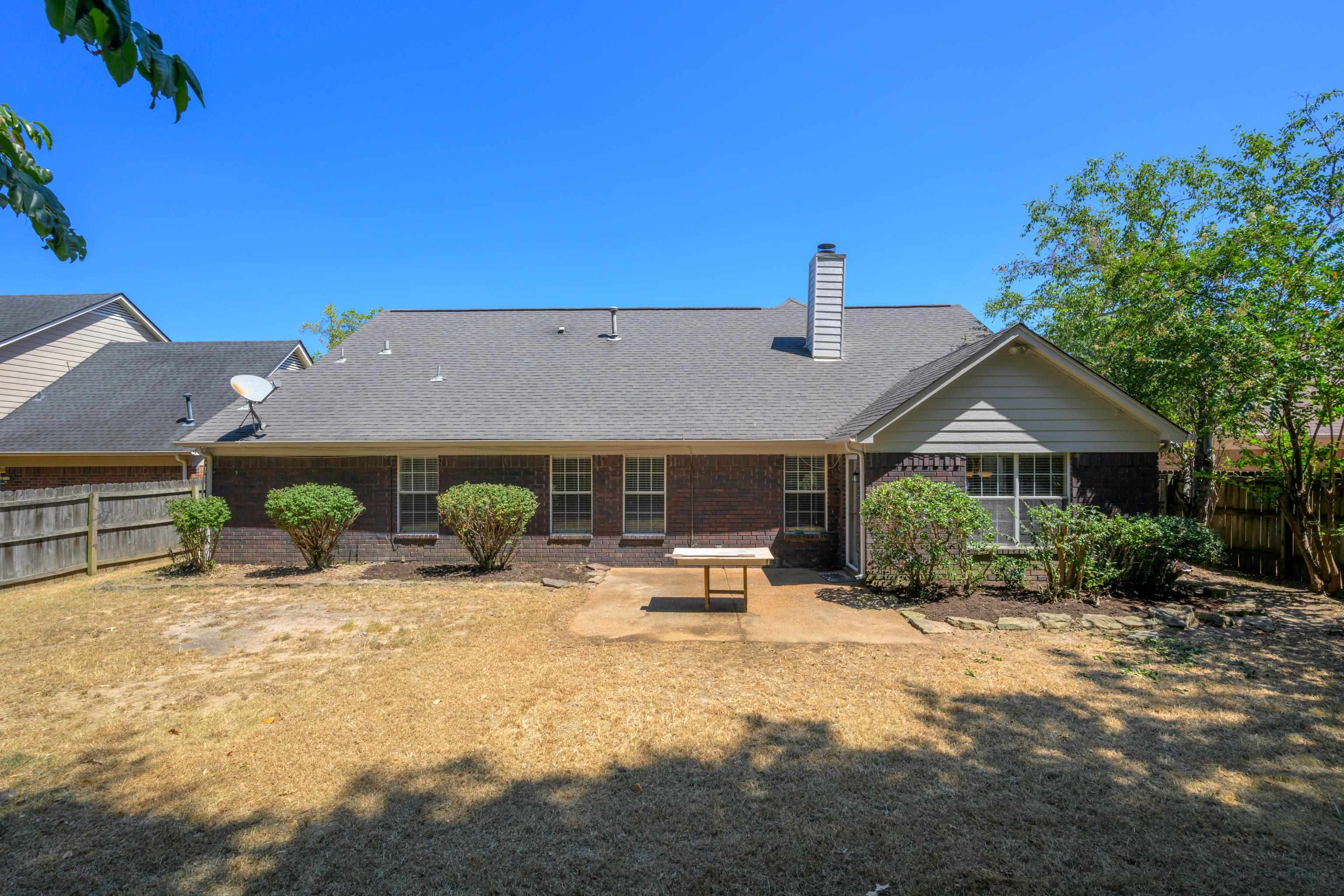 1361 Milestone Circle Collierville, TN 38017 - Photo 22 of 23 a front view of house with yard outdoor seating and barbeque oven