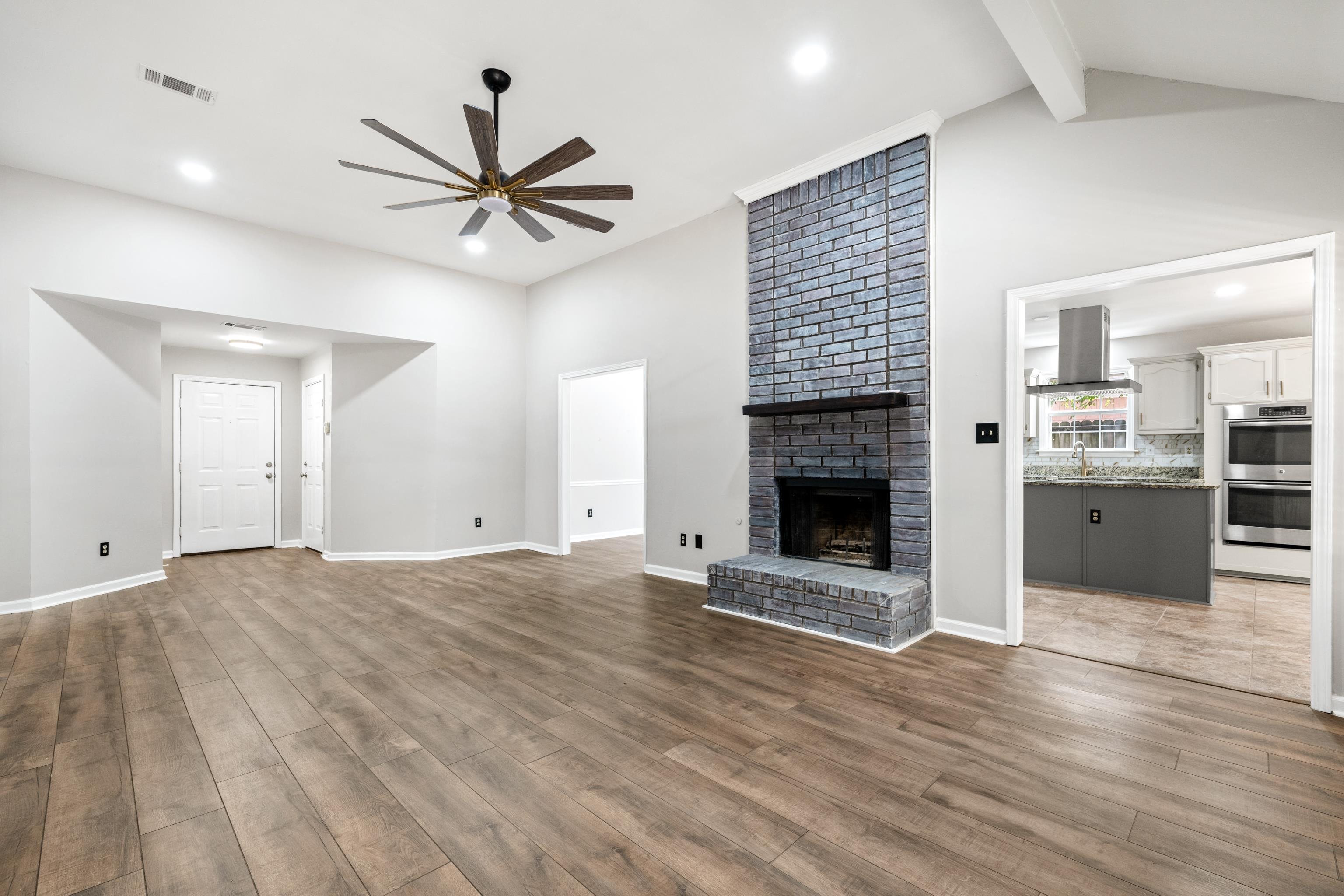1361 Milestone Circle Collierville, TN 38017 - Photo 3 of 23 a view of an empty room with a fireplace and window