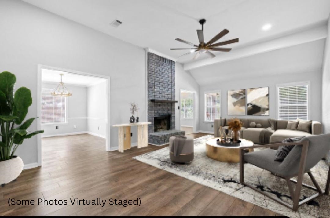 1361 Milestone Circle Collierville, TN 38017 - Photo 4 of 23 a living room with furniture dining table and a fireplace