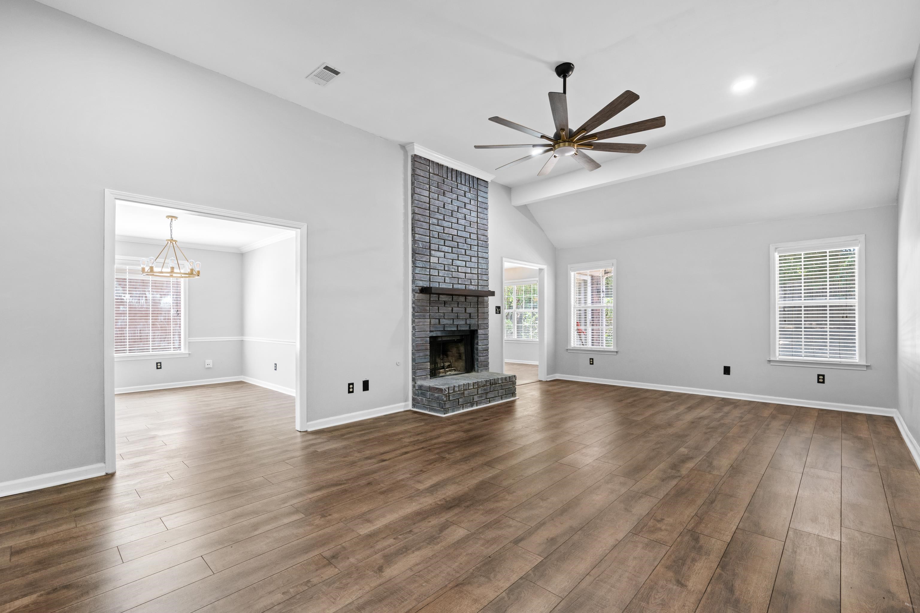 1361 Milestone Circle Collierville, TN 38017 - Photo 5 of 23 wooden floor in an empty room with a fireplace