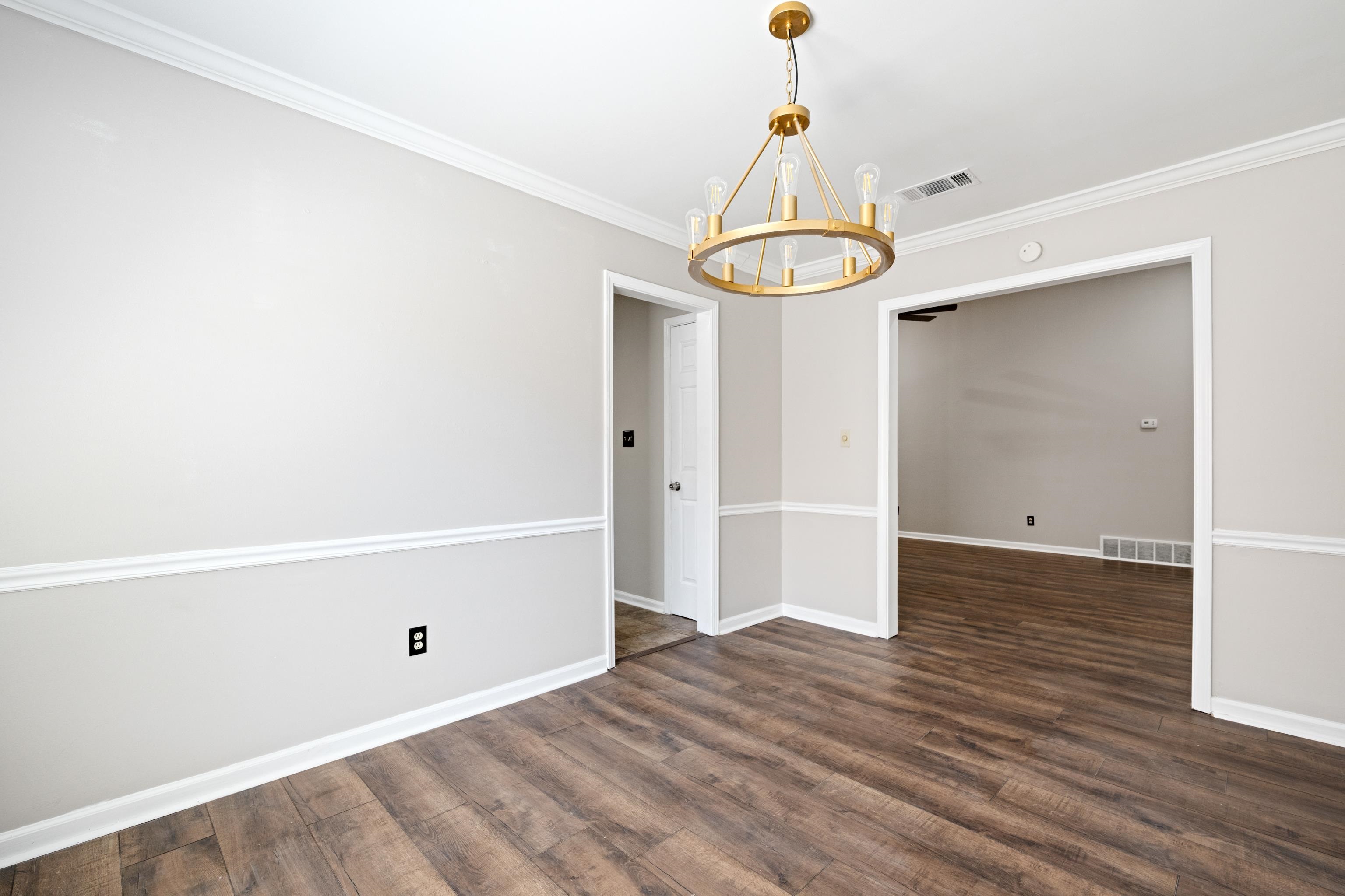1361 Milestone Circle Collierville, TN 38017 - Photo 8 of 23 a view of a room with wooden floor and white walls