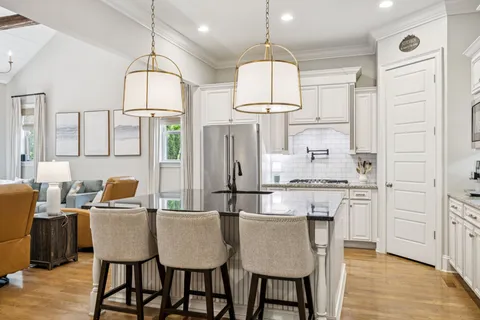 a kitchen with stainless steel appliances a sink stove and refrigerator