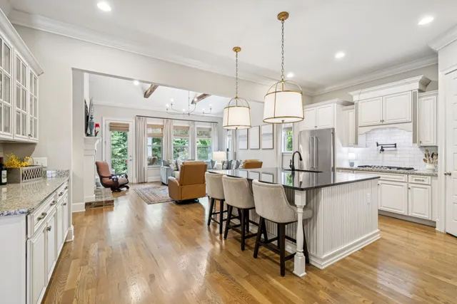 a kitchen with granite countertop cabinets and appliances