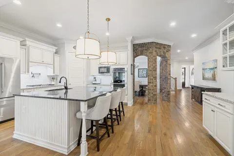 a living room with furniture fireplace and flat screen tv