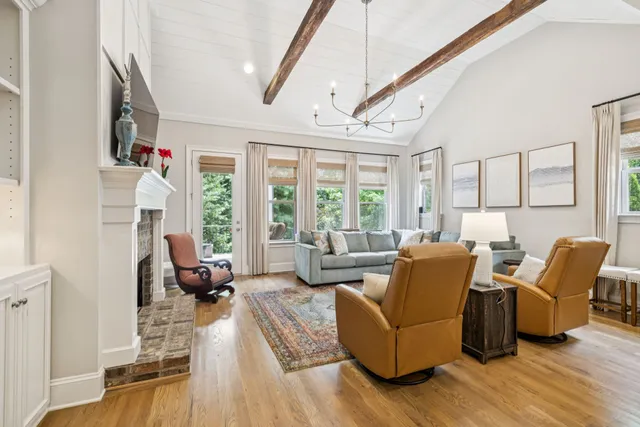 a kitchen with a refrigerator and a stove top oven