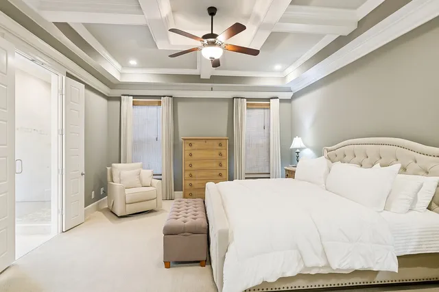 a en suite bathroom with a granite countertop sink mirror and shower