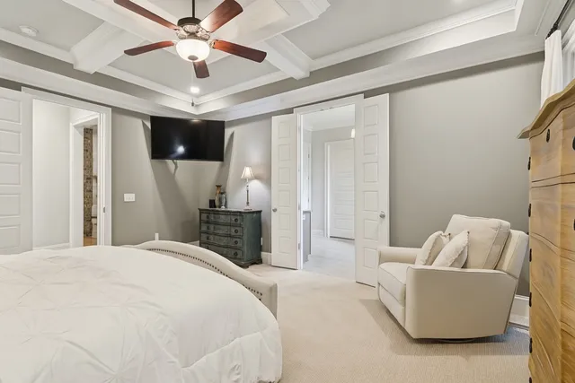 a bathroom with a white tub a toilet and a sink