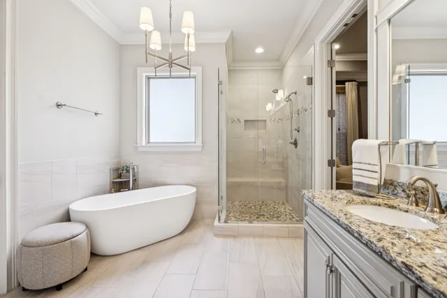 a bedroom with a bed and a table with chair