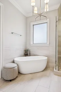 a bathroom with a granite countertop sink a large mirror and a sink