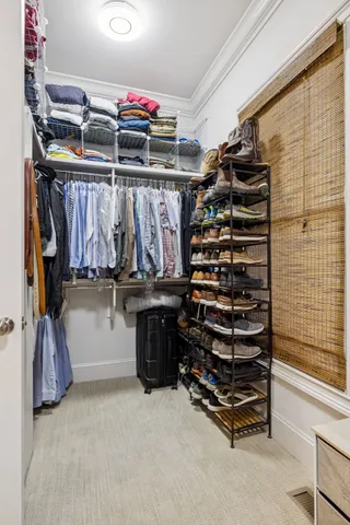 a bathroom with a granite countertop toilet sink and mirror