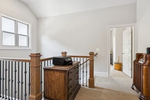 a view of a kitchen with furniture and wooden floor