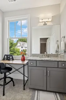 a backyard of a house with lots of green space and fountain