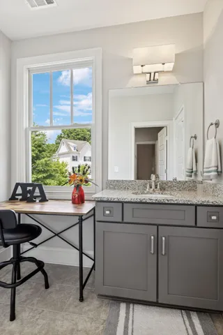 a backyard of a house with lots of green space and fountain