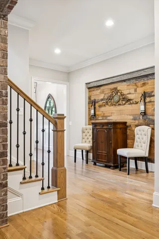 a view of a dining room with furniture wooden floor and chandelier
