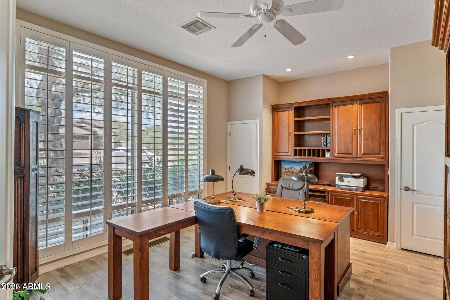 26601 North Aguila Road Rio Verde, AZ 85263 - Photo 14 of 45 a view of a workspace with furniture and a window