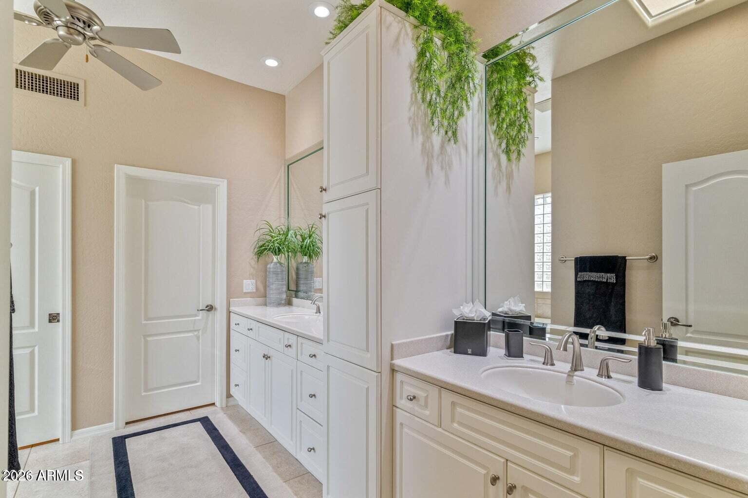 26601 North Aguila Road Rio Verde, AZ 85263 - Photo 19 of 45 a bathroom with a double vanity sink and a mirror