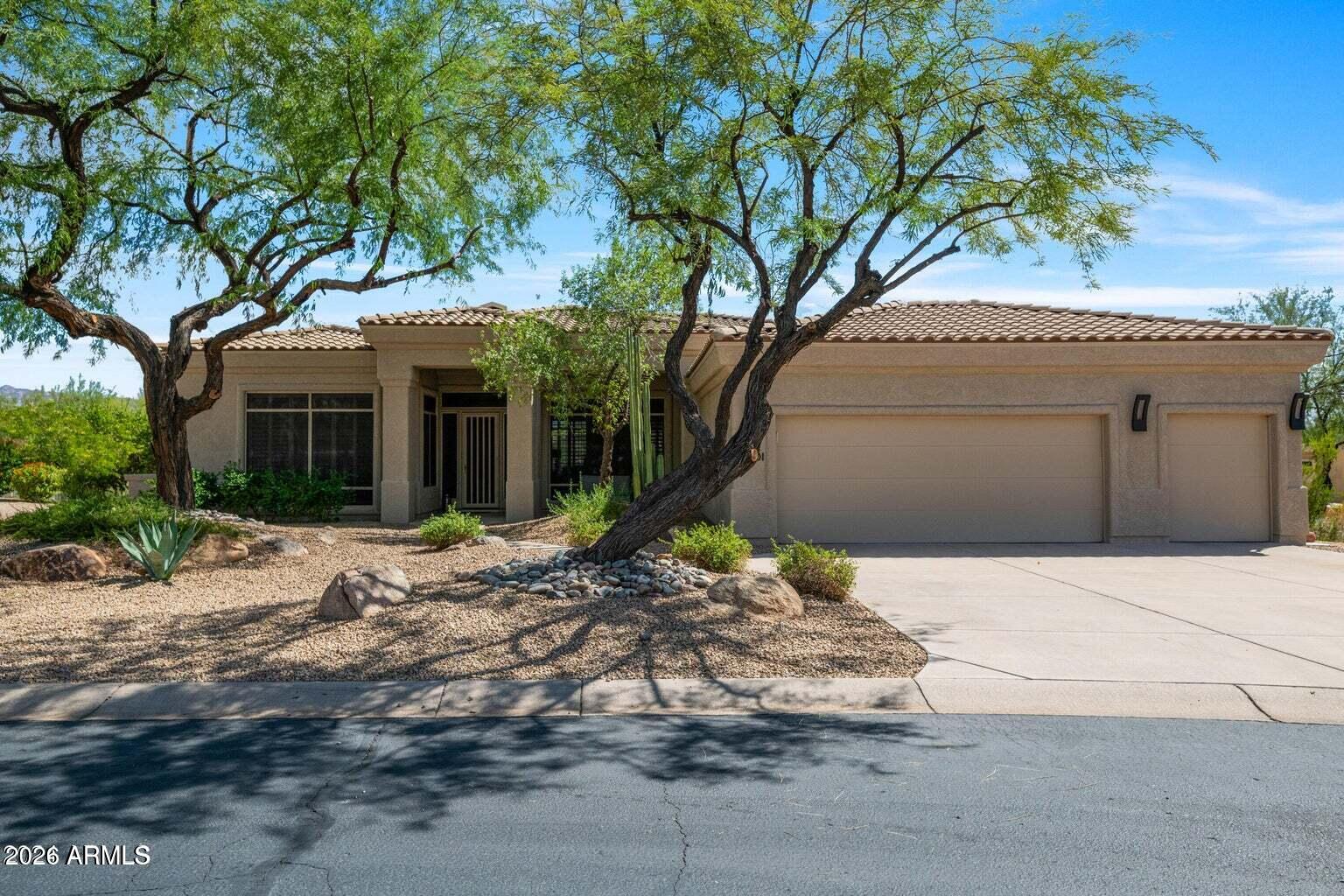 26601 North Aguila Road Rio Verde, AZ 85263 - Photo 2 of 45 a house with a tree in front of it