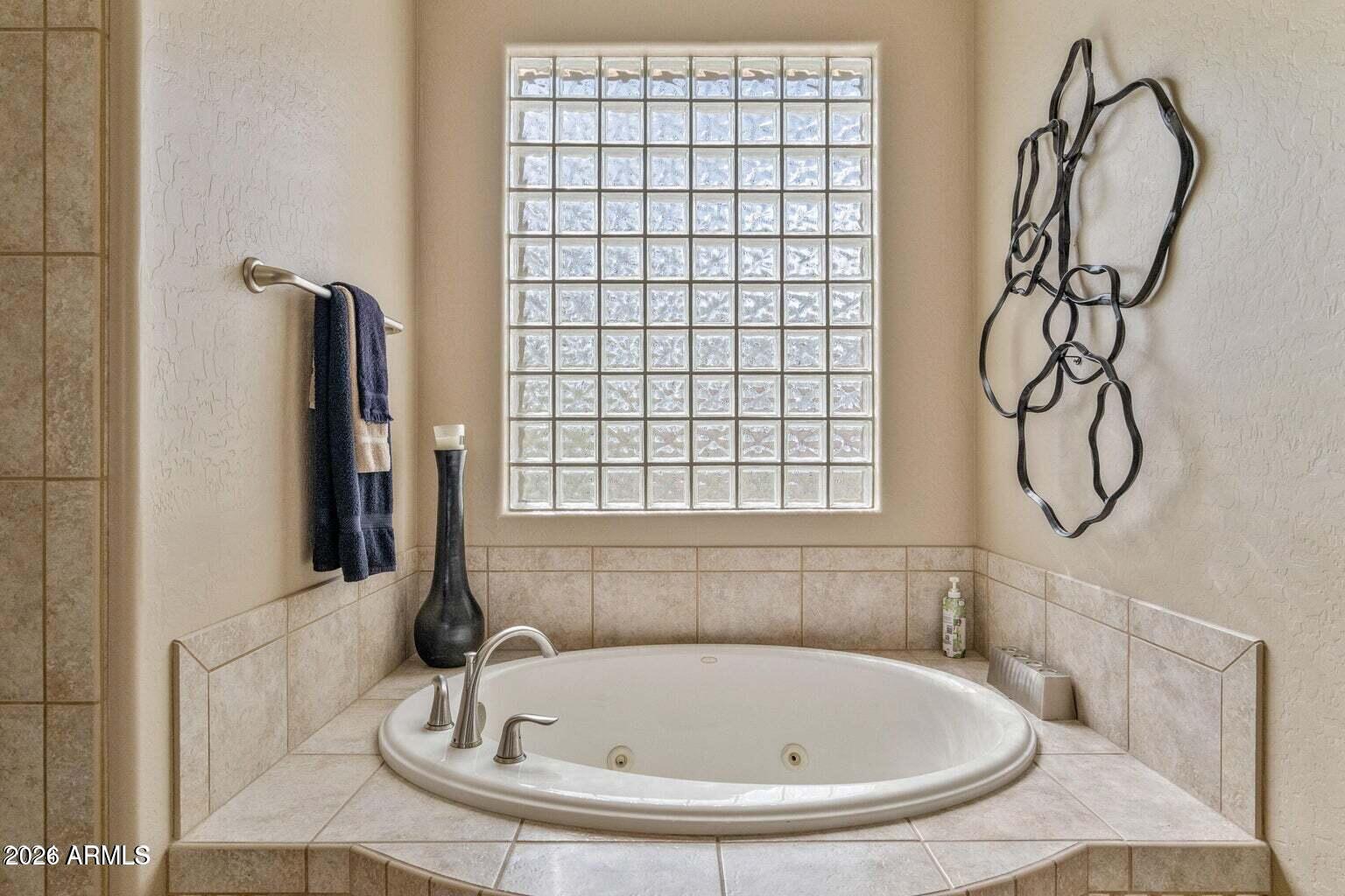 26601 North Aguila Road Rio Verde, AZ 85263 - Photo 22 of 45 a bathroom with a bath tub and a shower