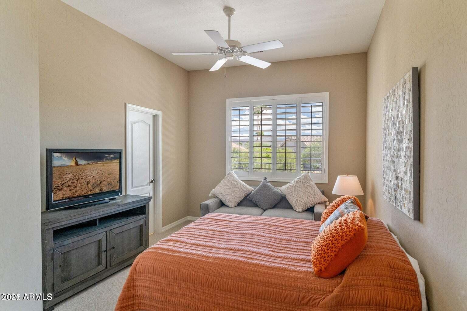 26601 North Aguila Road Rio Verde, AZ 85263 - Photo 29 of 45 a bedroom with a bed and a flat screen tv